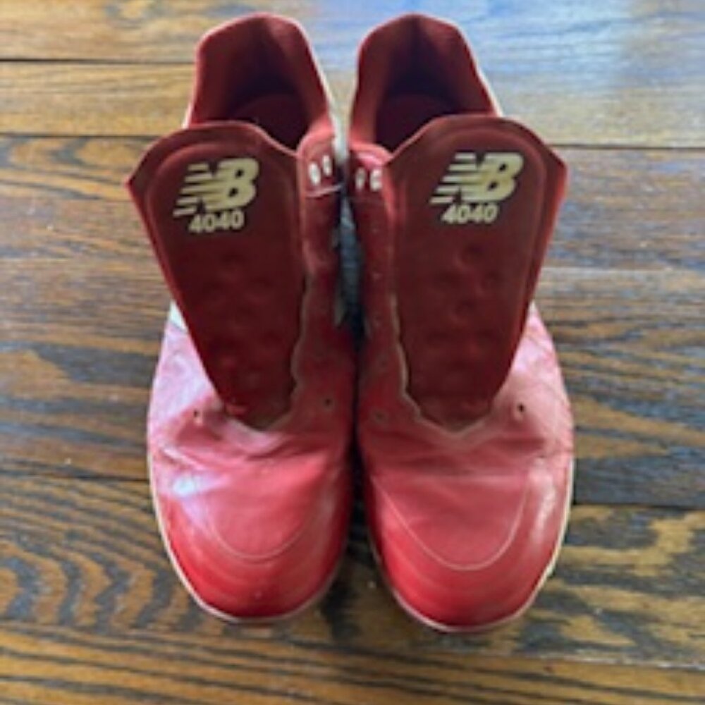 New Balance Red Cleats.
